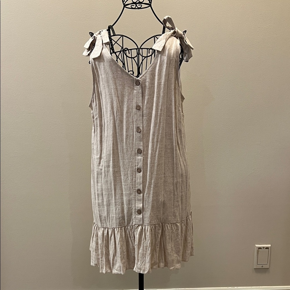 Versona linen blend button-front dress with tie shoulders and a ruffle hem.